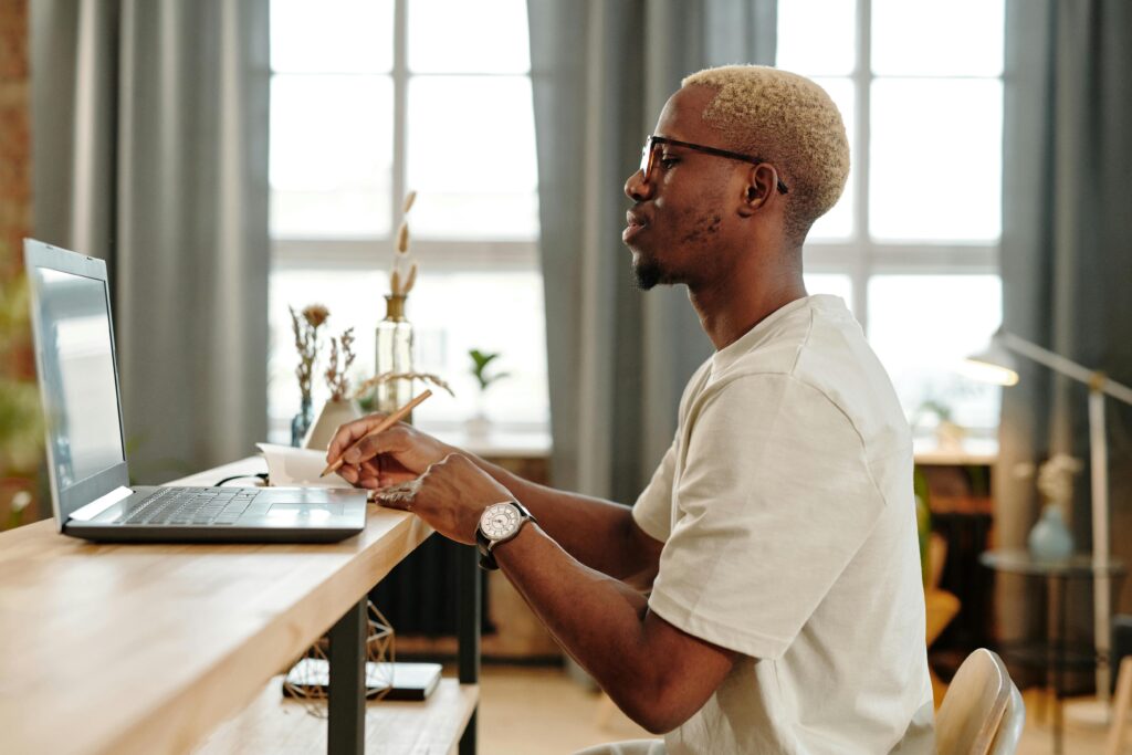 Photo of man on his laptop