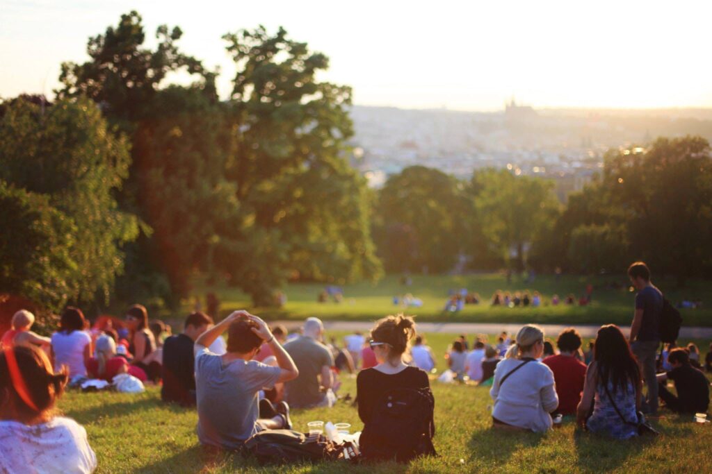 Photo of people sitting in the sun