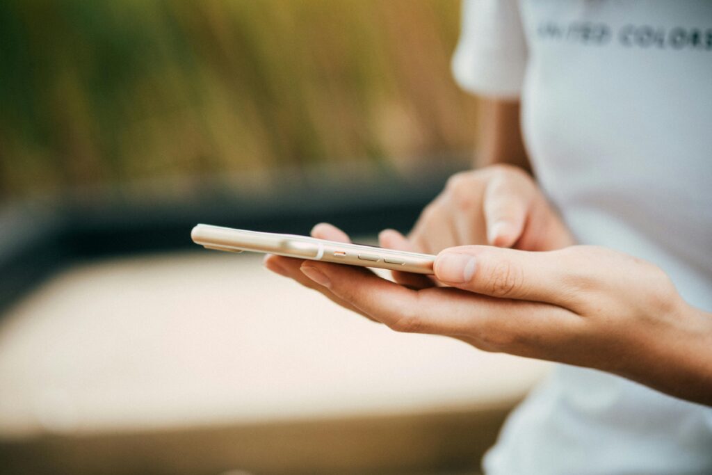 Photo of woman using her phone