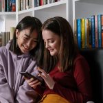 Photo of girls looking at a phone