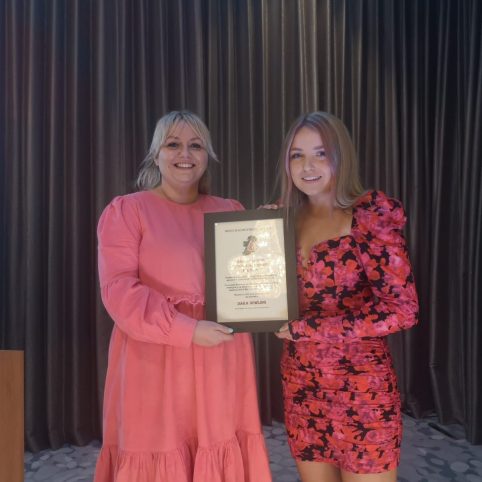 Photo of Dara Dowling receiving an educational grant