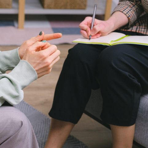 Woman talking to doctor