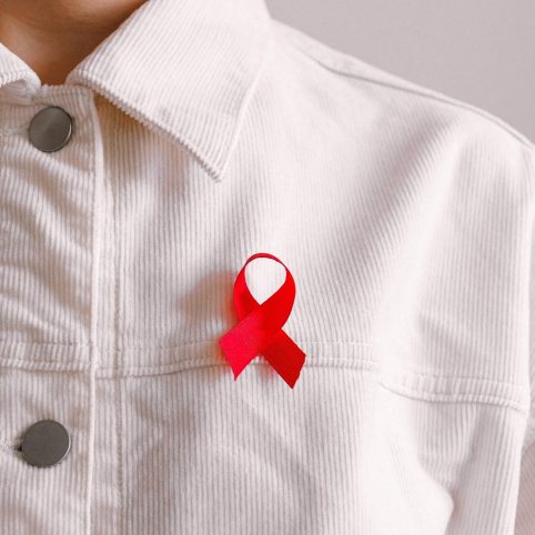 Photo of man wearing aids ribbon