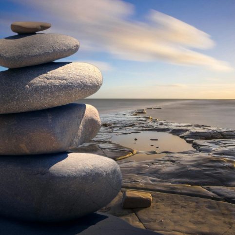 Photo of stones stacked in beautiful landscape
