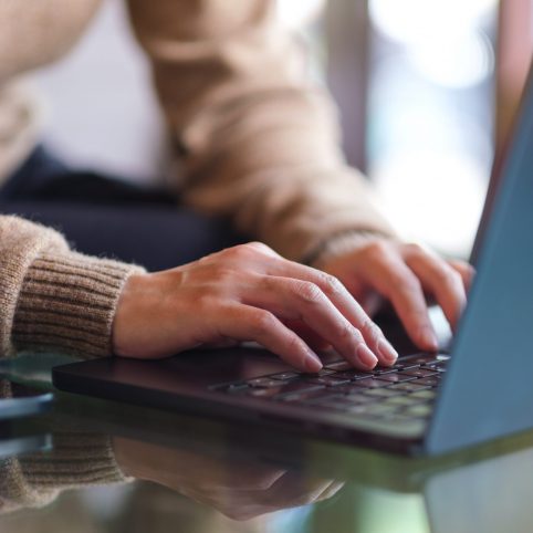 Closeup,Image,Of,A,Woman,Working,And,Typing,On,Laptop